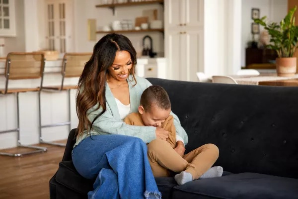 A mother hugging her son in their clean home thanks to Zerorez Calgary.
