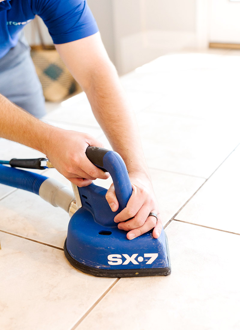 This Zerorez Calgary professional is cleaning harmful dirt particles and allergens from grout.